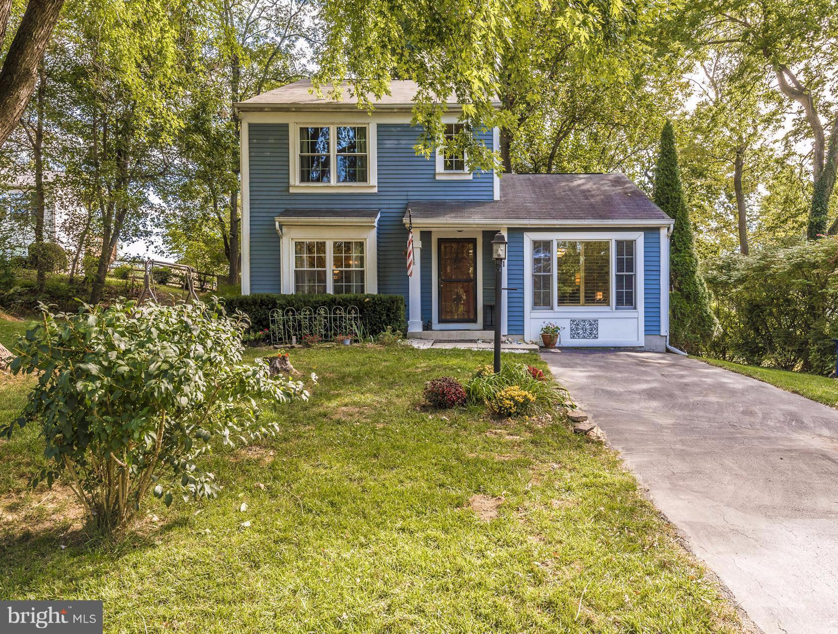 1701 Brookshire Run Point of Rocks, MD 21777 - Photo 2 of 26 a front view of a house with yard and green space