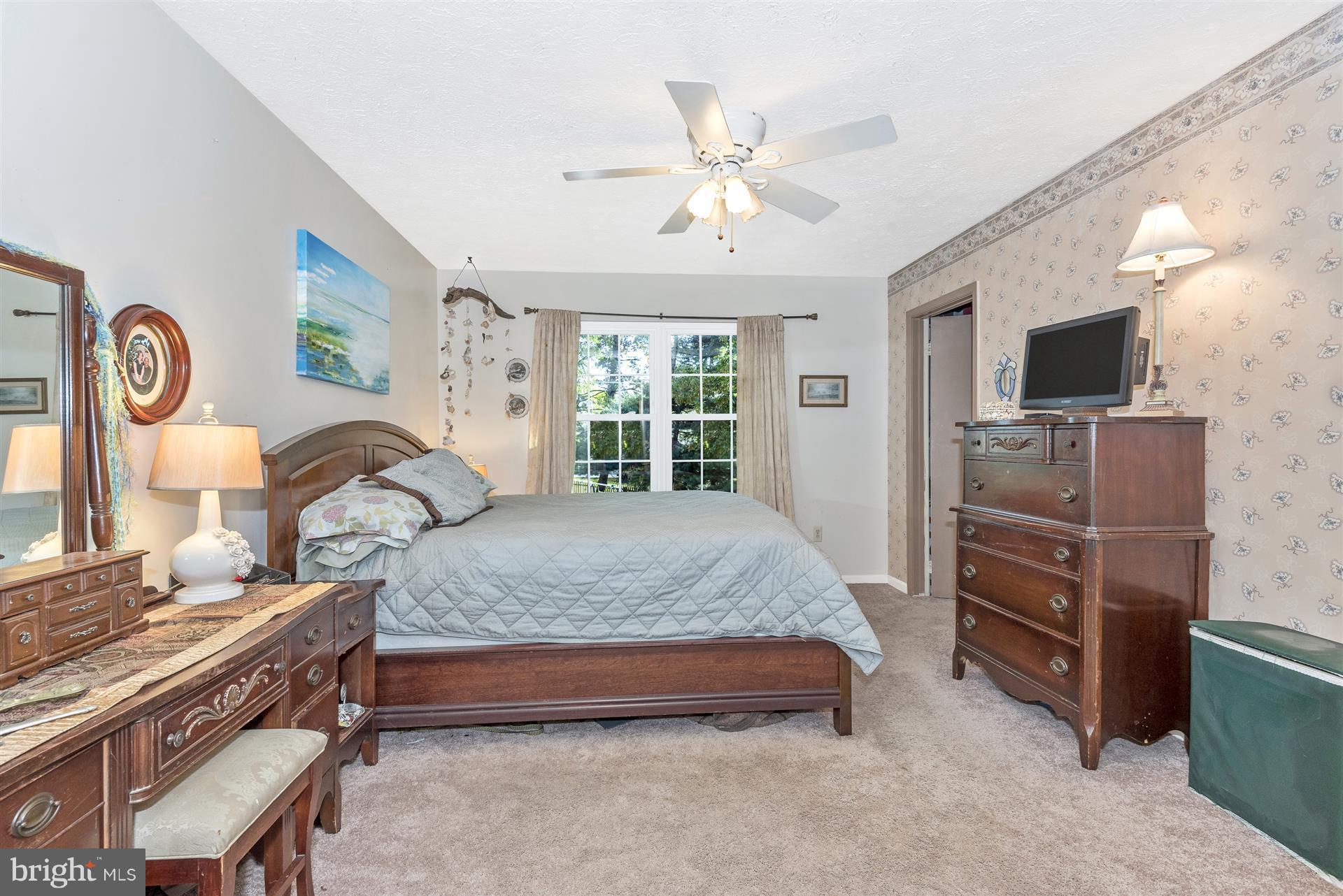 1701 Brookshire Run Point of Rocks, MD 21777 - Photo 14 of 26 a bedroom with a bed and a chandelier