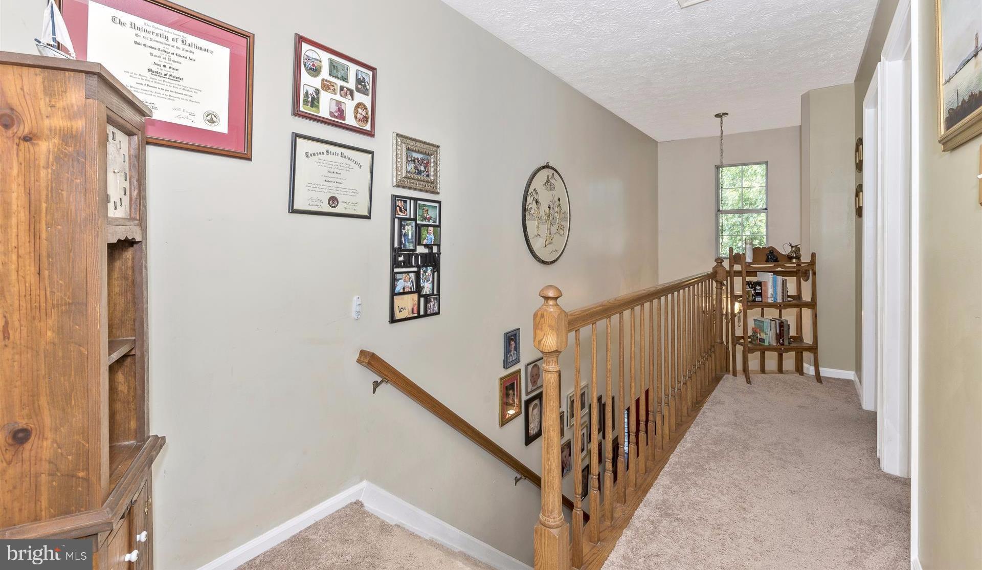 1701 Brookshire Run Point of Rocks, MD 21777 - Photo 19 of 26 a view of a hallway with paintings on the wall