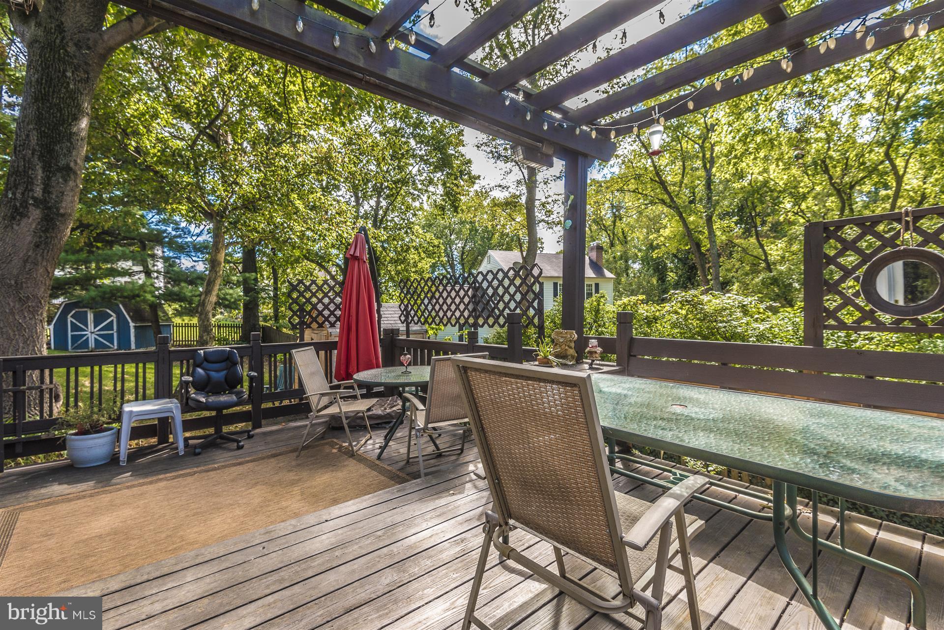 1701 Brookshire Run Point of Rocks, MD 21777 - Photo 20 of 26 a view of a patio with table and chairs and wooden floor