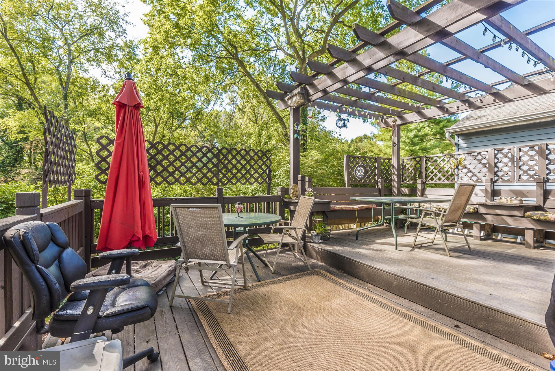 1701 Brookshire Run Point of Rocks, MD 21777 - Photo 21 of 26 a view of a patio with a dining table and chairs with wooden floor and fence