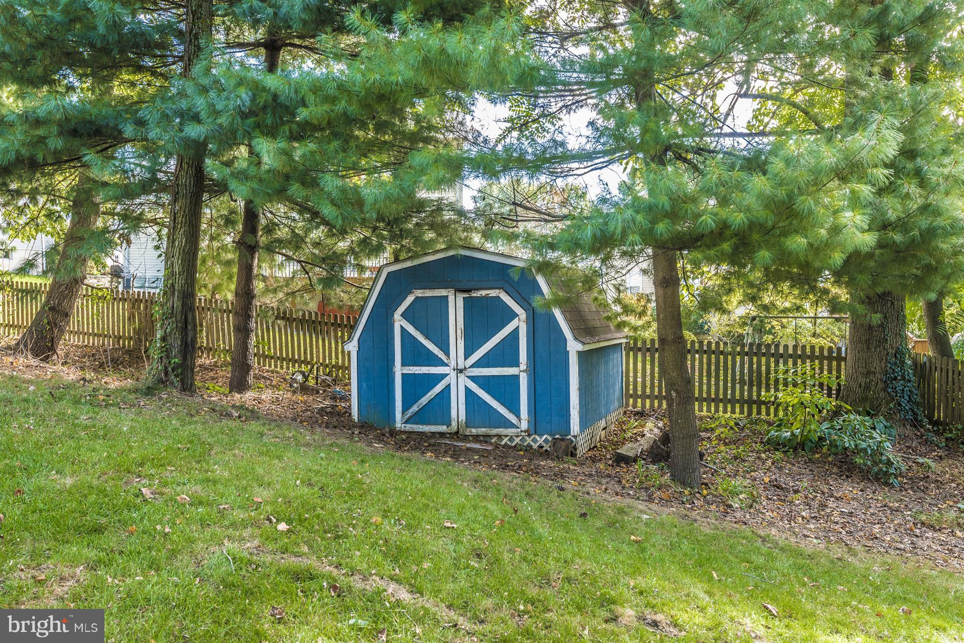 1701 Brookshire Run Point of Rocks, MD 21777 - Photo 22 of 26 a view of a wooden house with a yard and large trees