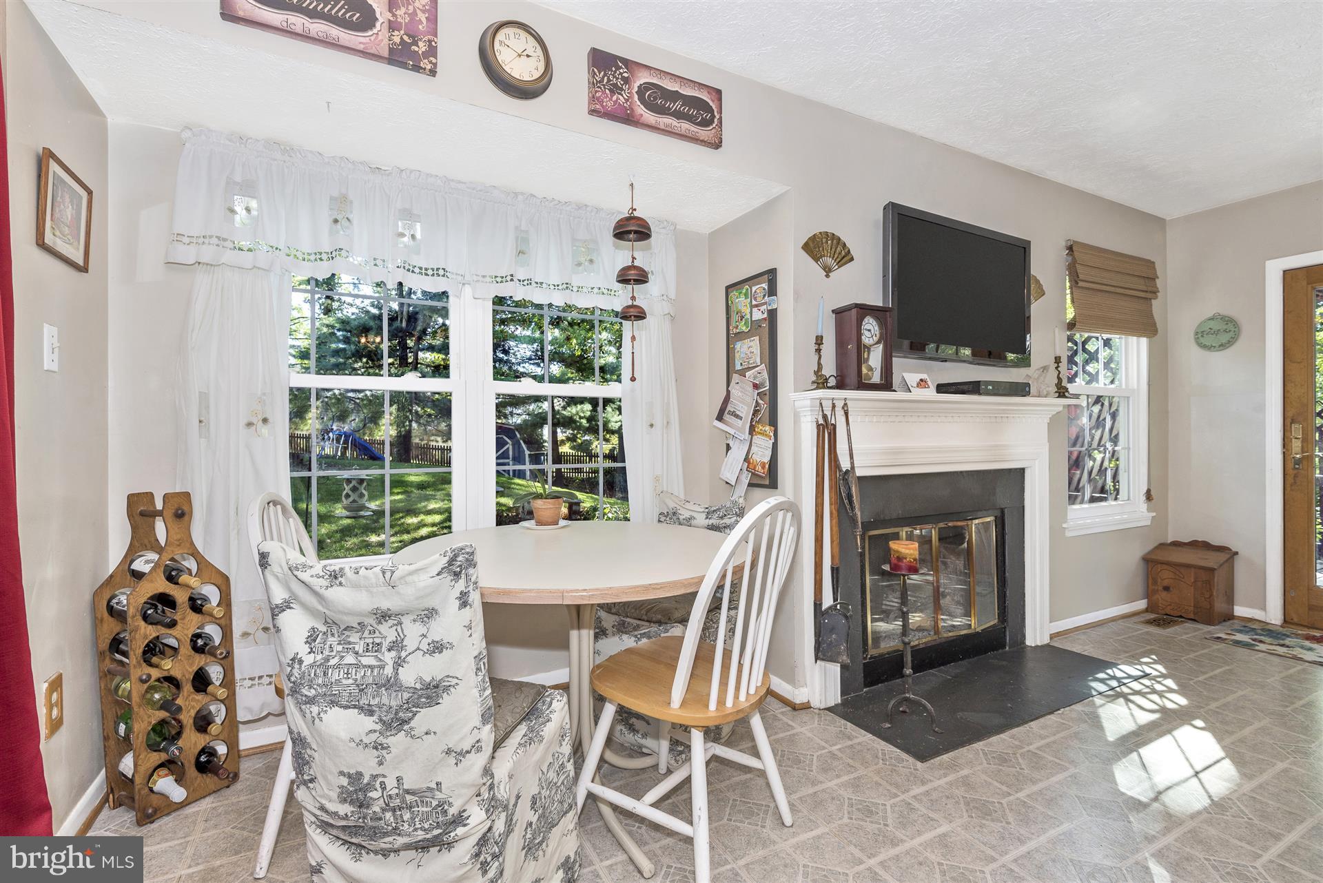 1701 Brookshire Run Point of Rocks, MD 21777 - Photo 5 of 26 a dining room with furniture and a fireplace