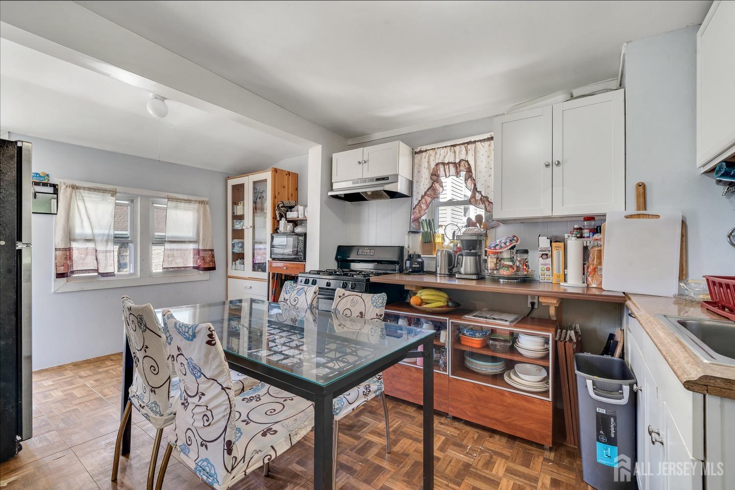 64 Commerce Street Perth Amboy, NJ 08861 - Photo 12 of 25 a view of a kitchen and dining room