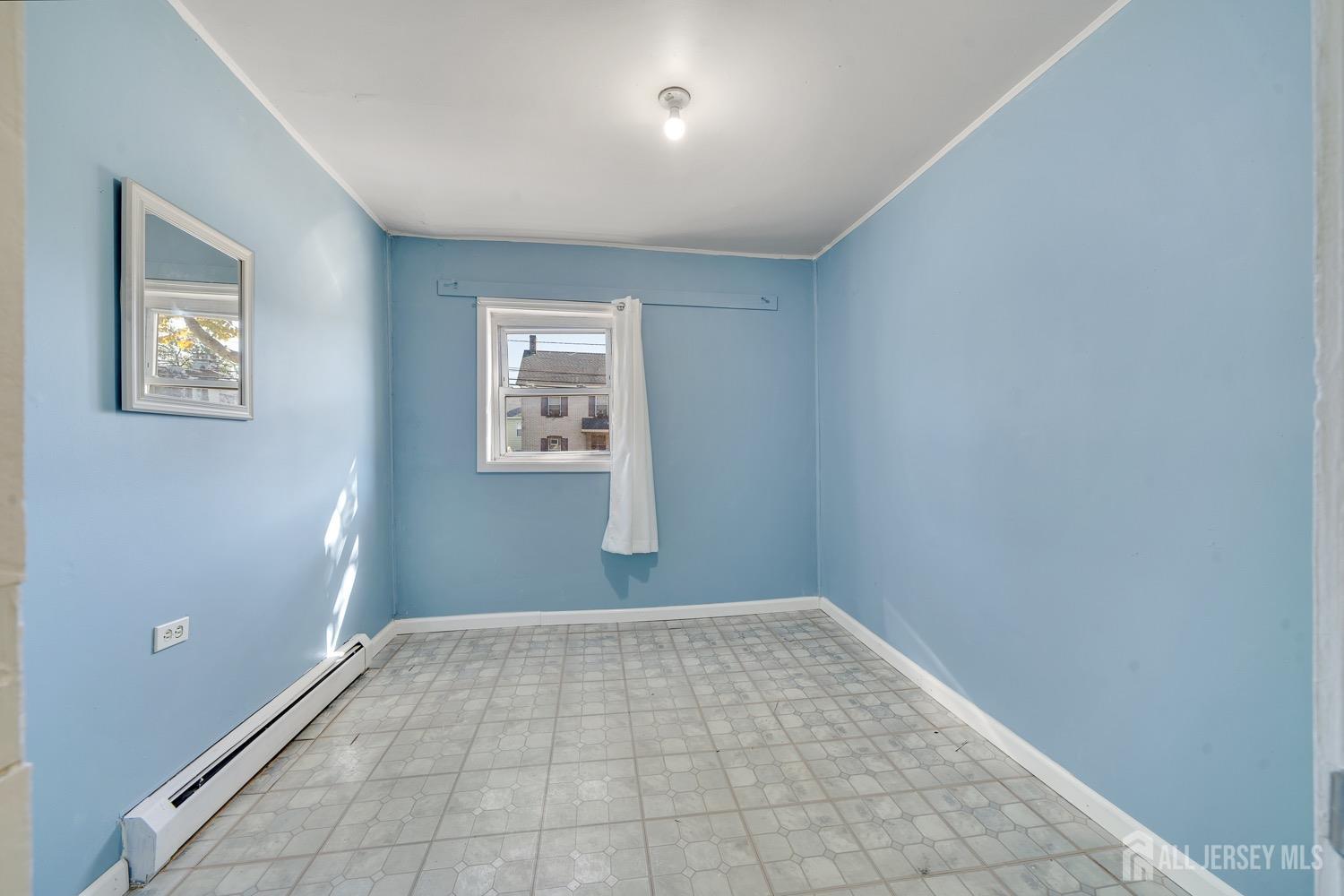 64 Commerce Street Perth Amboy, NJ 08861 - Photo 19 of 25 an empty room with windows