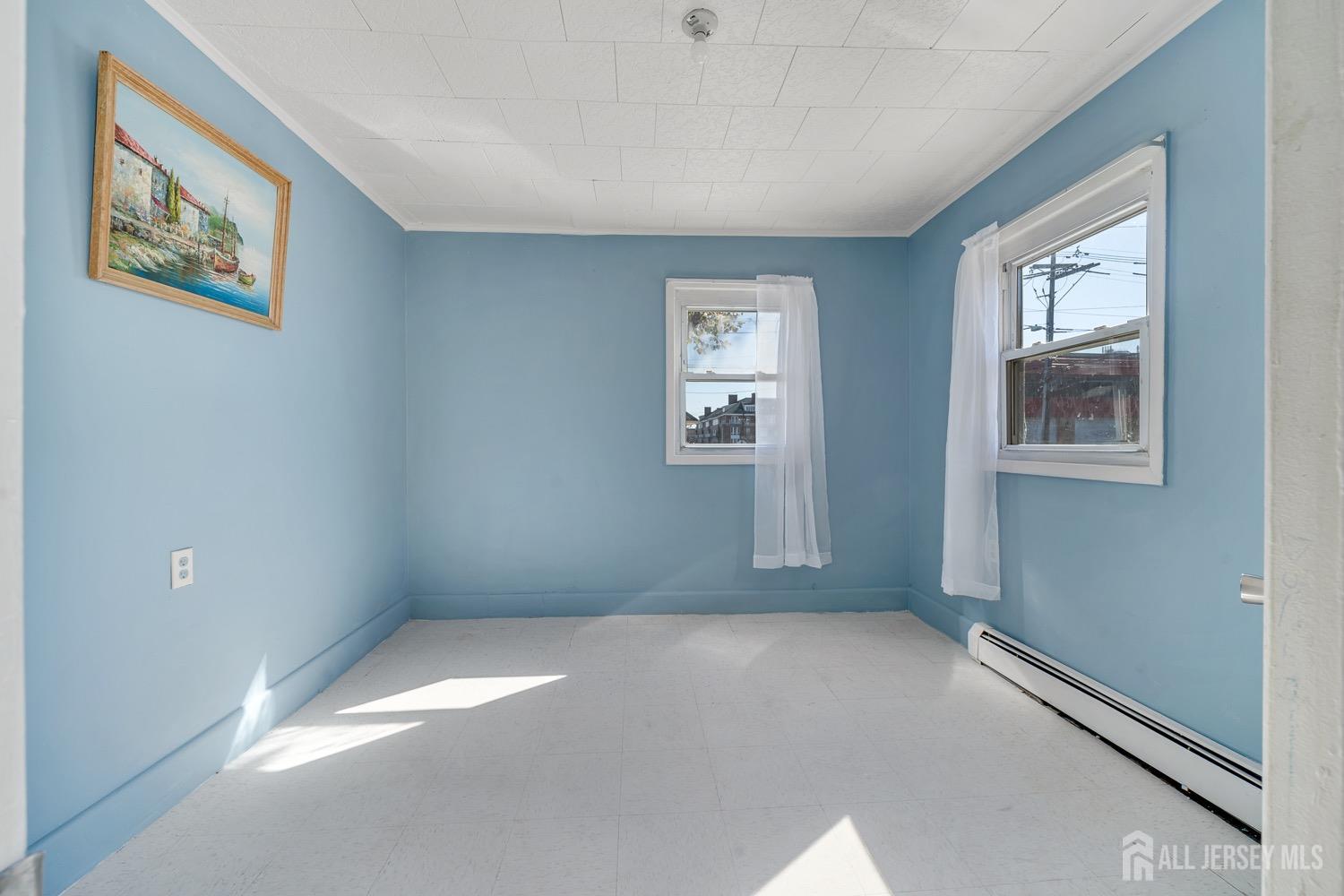 64 Commerce Street Perth Amboy, NJ 08861 - Photo 20 of 25 an empty room with windows