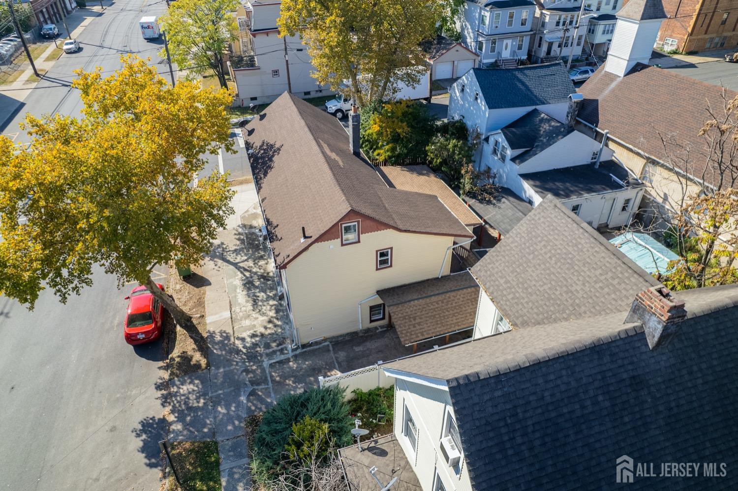64 Commerce Street Perth Amboy, NJ 08861 - Photo 4 of 25 an aerial view of a house with a yard