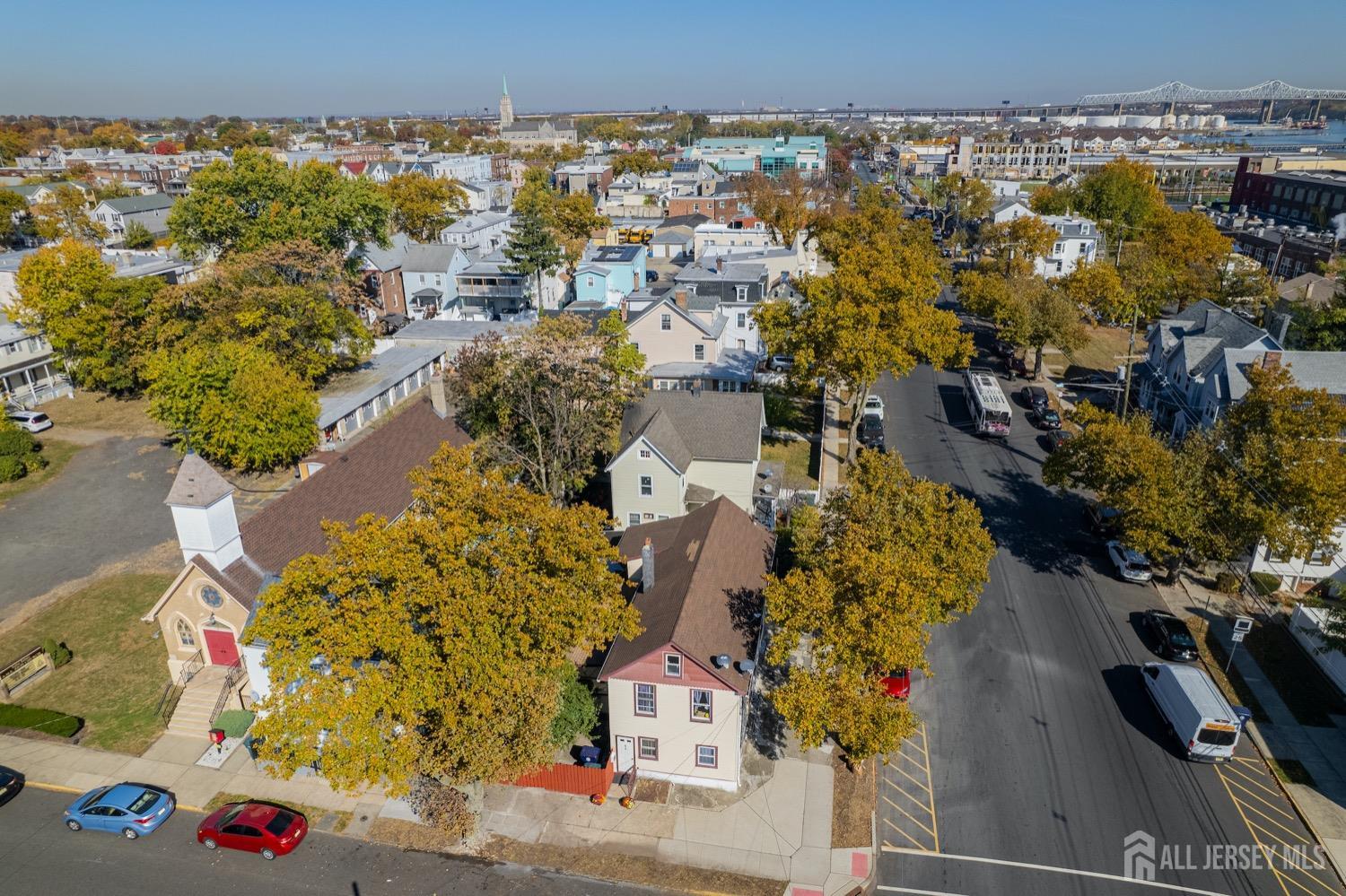 64 Commerce Street Perth Amboy, NJ 08861 - Photo 5 of 25 an aerial view of residential houses with outdoor space