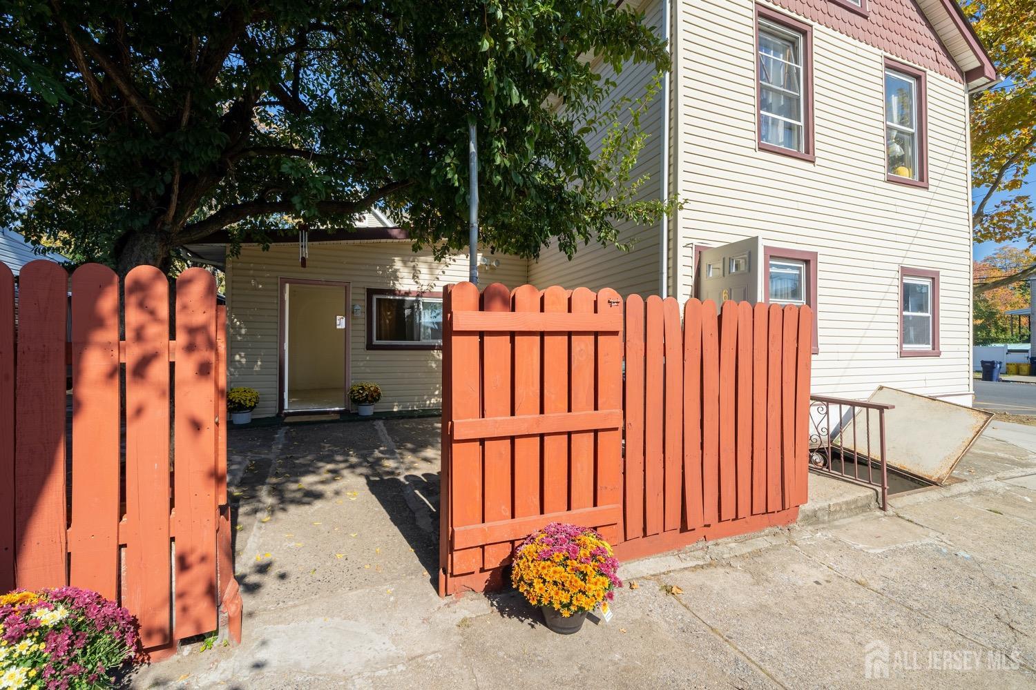 64 Commerce Street Perth Amboy, NJ 08861 - Photo 6 of 25 a view of a house with backyard and sitting area