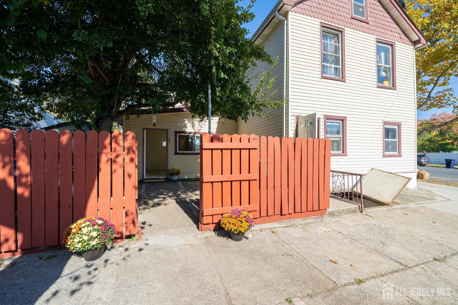 64 Commerce Street Perth Amboy, NJ 08861 - Photo 7 of 25 a view of a chairs and a garage