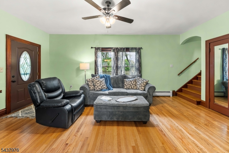 886 Brass Castle Road Belvidere, NJ 07823 - Photo 8 of 44 a living room with furniture and a wooden floor