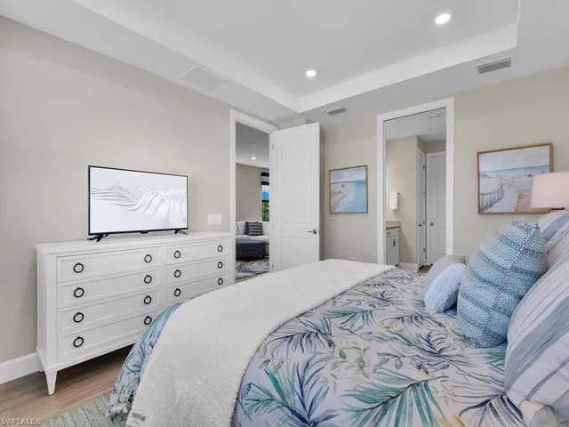 a bedroom with a bed and a dresser