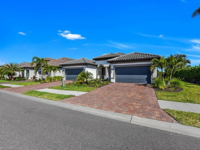 a view of house with yard and green space