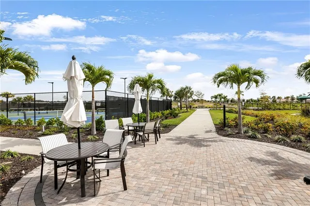 a view of a backyard with sitting area
