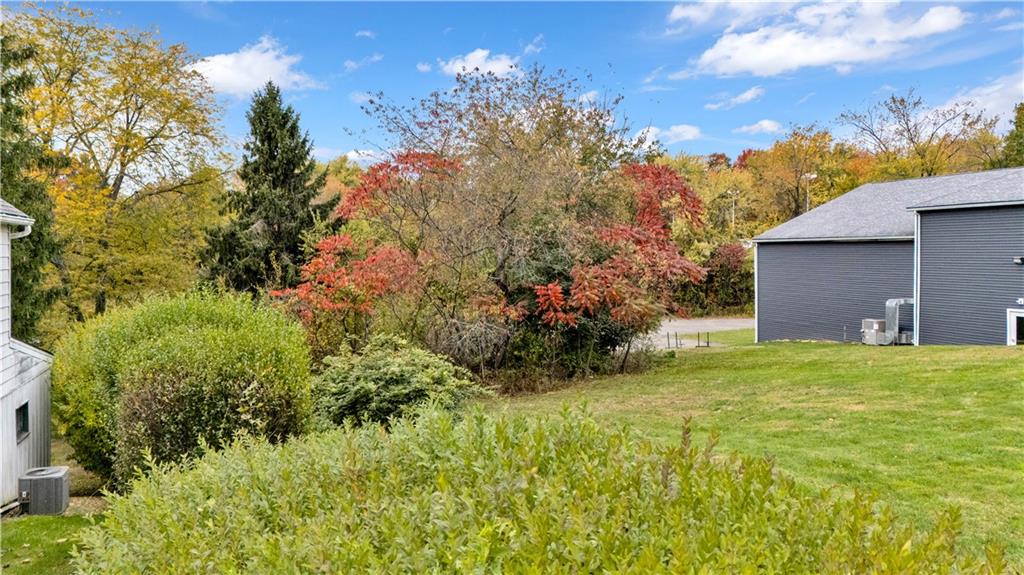 2073 Brodhead Road Aliquippa, PA 15001 - Photo 2 of 4 a view of a garden with a house