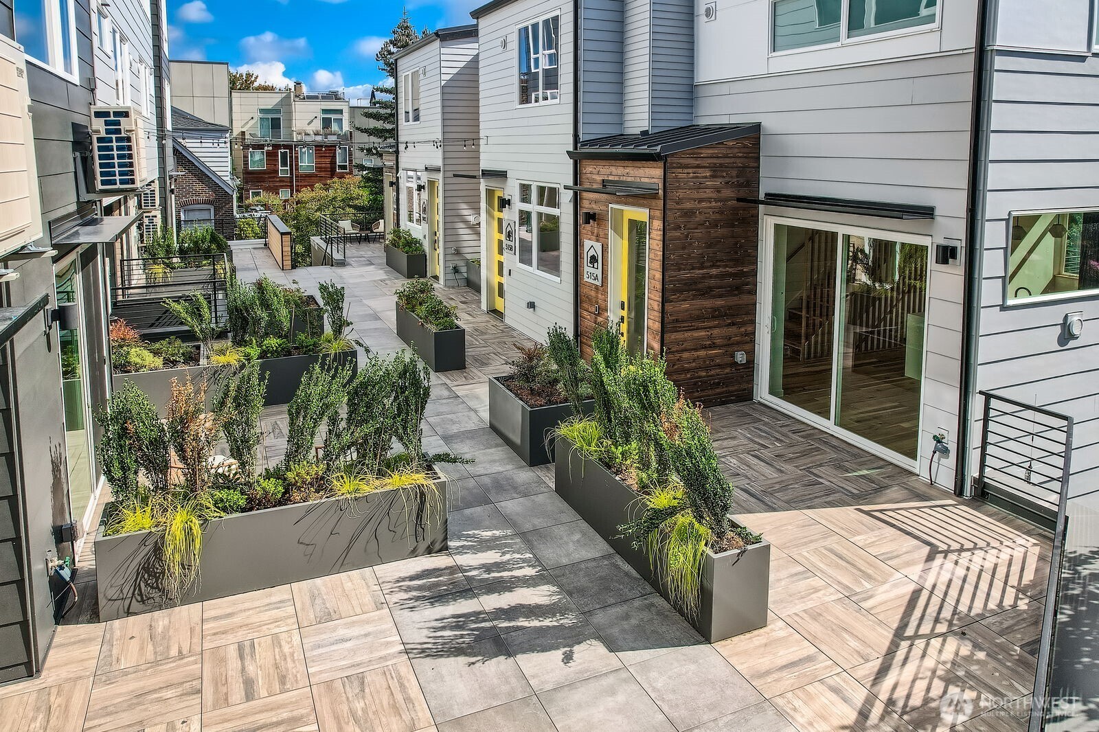 a view of a potted flower in front of a house