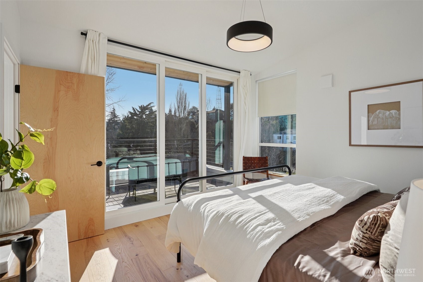 515 Howe Street, Unit A Seattle, WA 98109 - Photo 12 of 40 a bedroom with a bed and a window