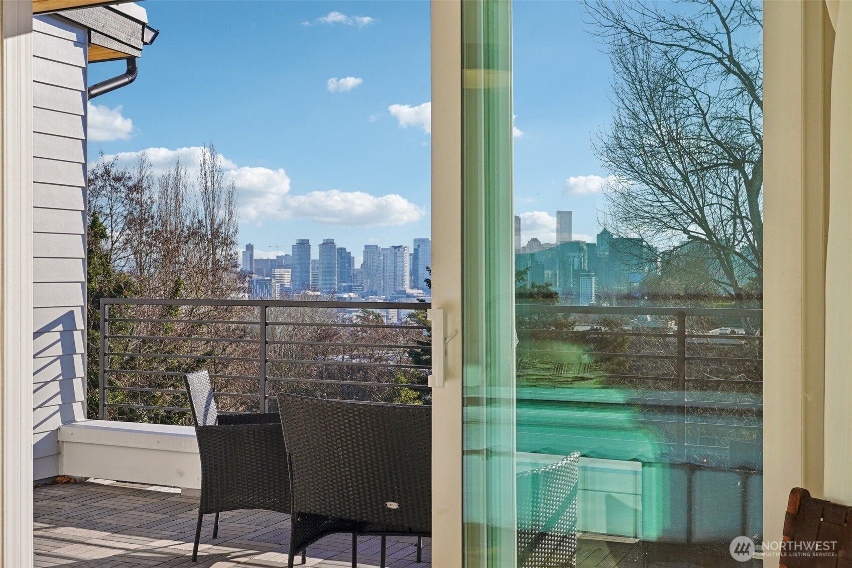 515 Howe Street, Unit A Seattle, WA 98109 - Photo 14 of 40 a view of a balcony with a table and chairs
