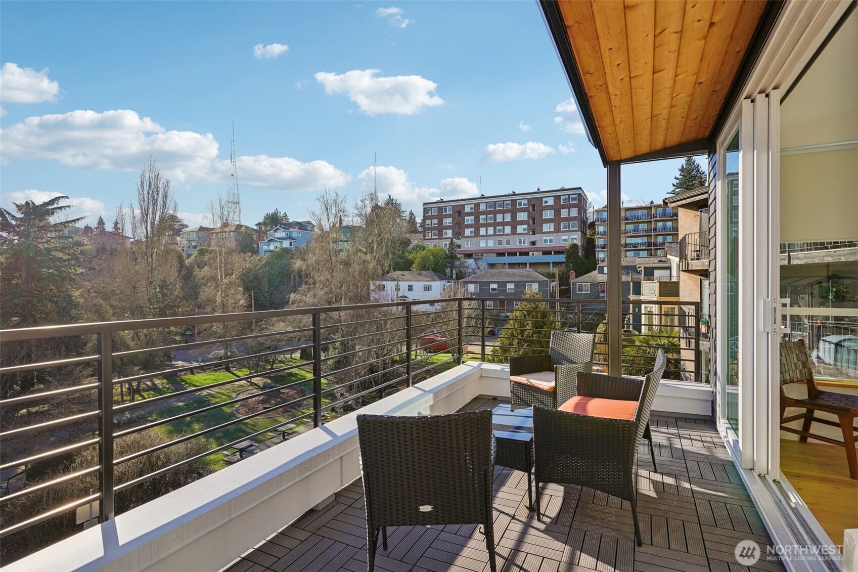 515 Howe Street, Unit A Seattle, WA 98109 - Photo 16 of 40 a view of a chairs and table in the balcony