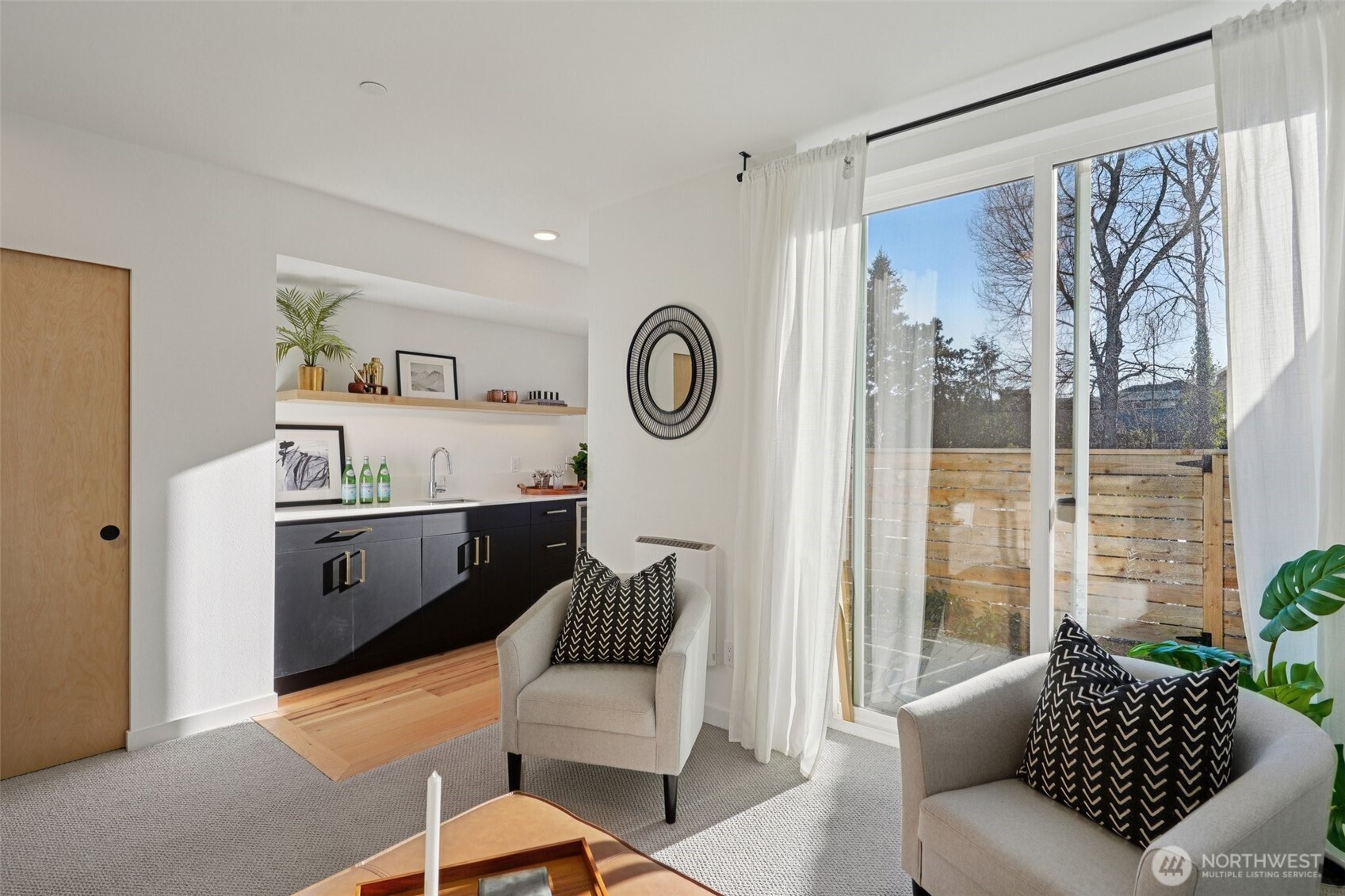 515 Howe Street, Unit A Seattle, WA 98109 - Photo 24 of 40 a living room with furniture and a large window