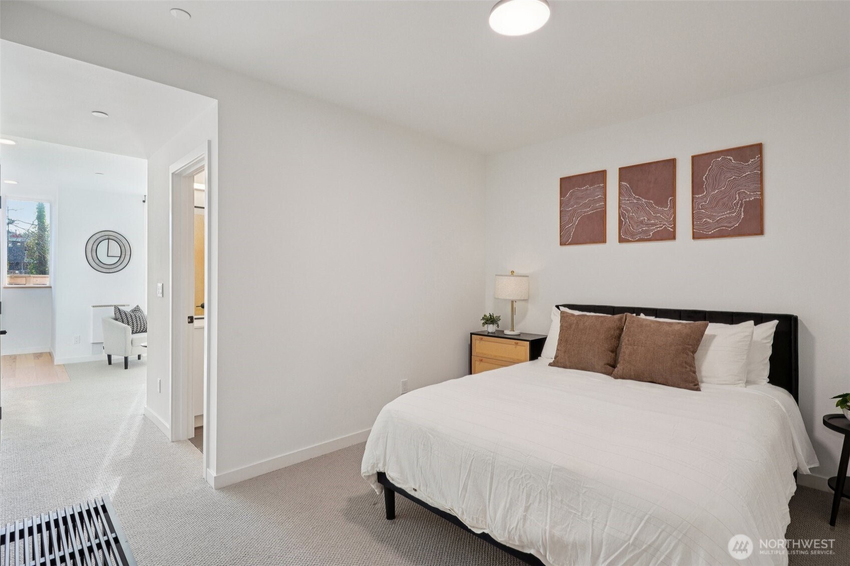 515 Howe Street, Unit A Seattle, WA 98109 - Photo 26 of 40 a bedroom with a bed and painting on the wall