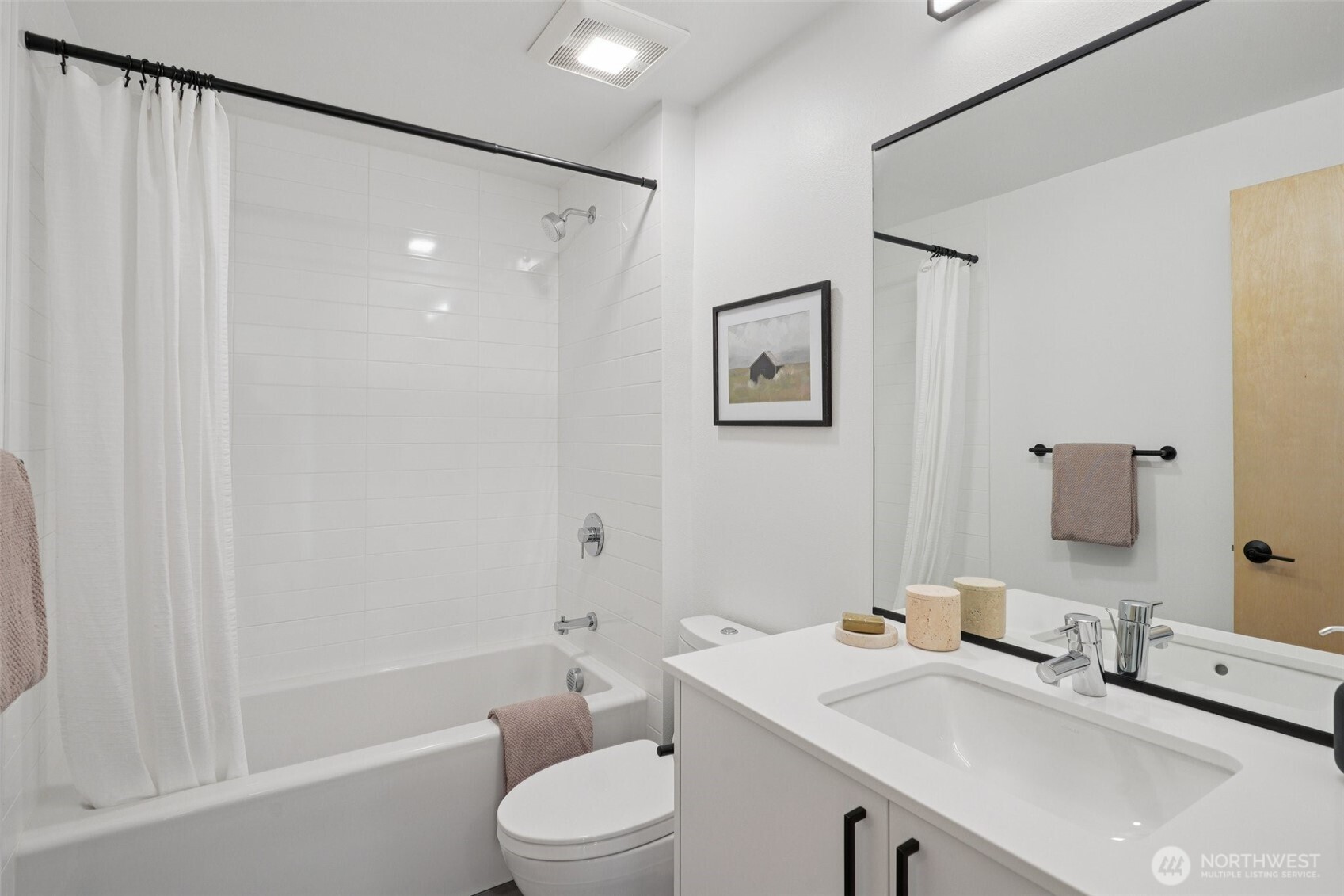 515 Howe Street, Unit A Seattle, WA 98109 - Photo 27 of 40 a bathroom with a sink a toilet and shower