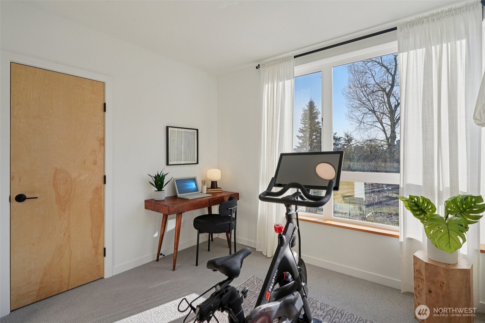 515 Howe Street, Unit A Seattle, WA 98109 - Photo 28 of 40 a view of a workspace with furniture and a window