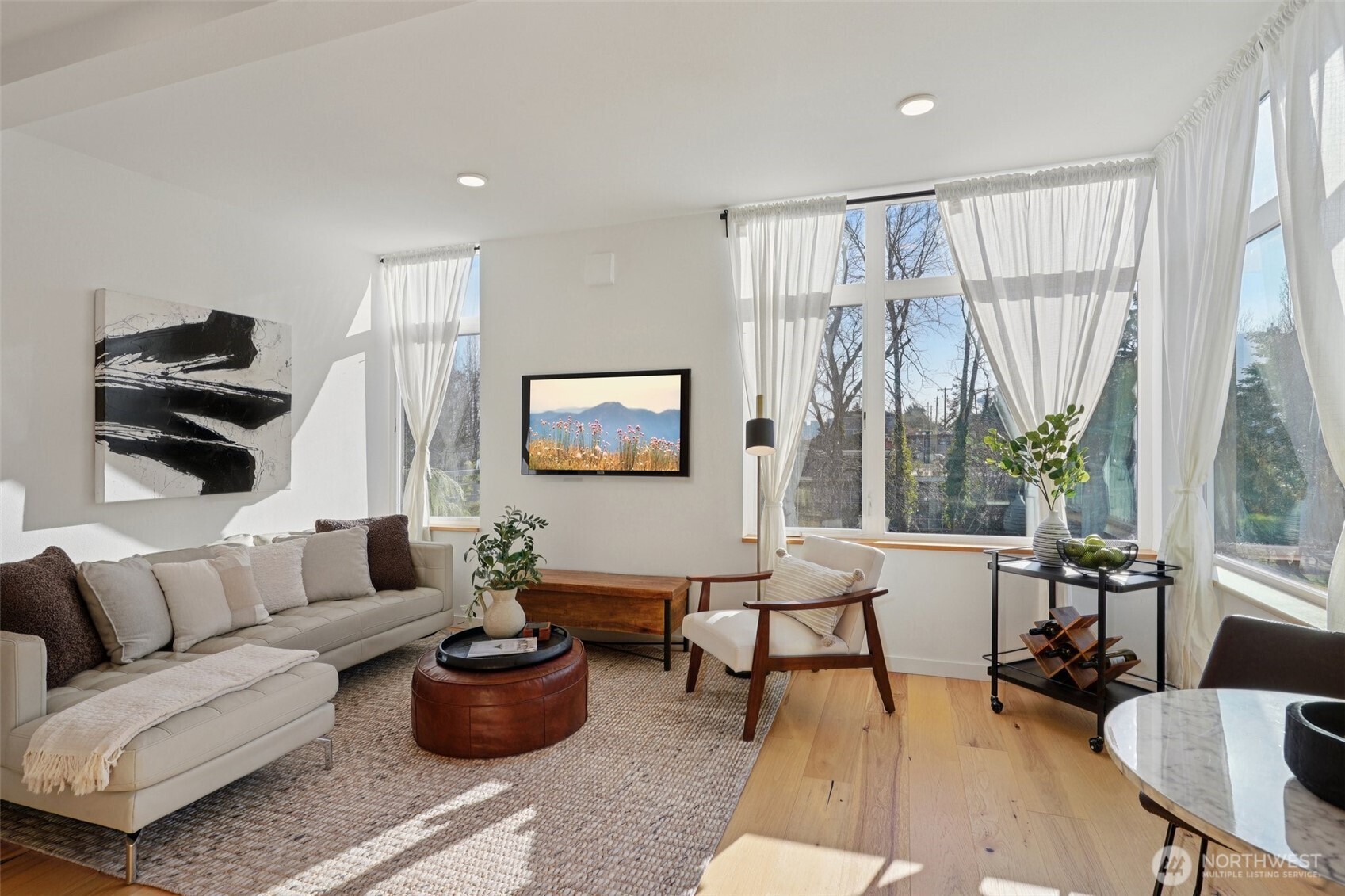 515 Howe Street, Unit A Seattle, WA 98109 - Photo 10 of 40 a living room with furniture and a large window