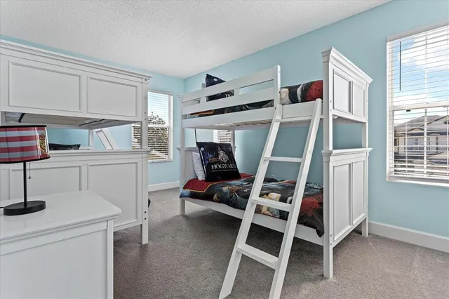 a bedroom with furniture and a window