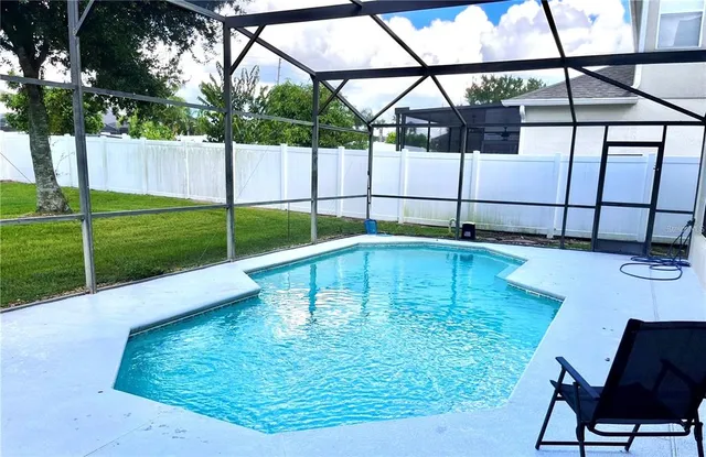 a view of a backyard of the house
