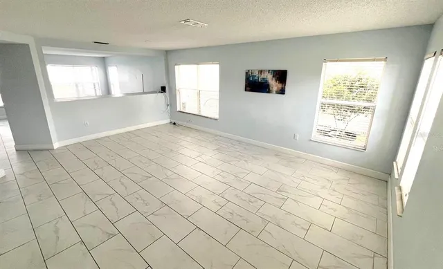 a view of an empty room and window