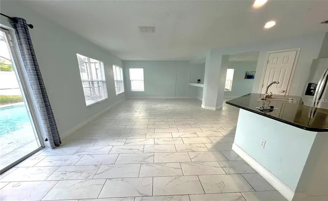 a view of a kitchen with a sink and a window