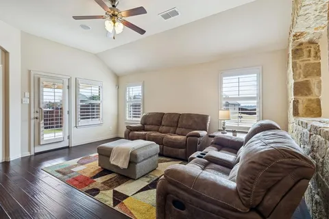 a living room with furniture and a window