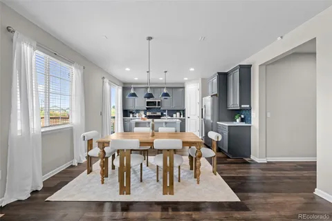 a view of a dining room with furniture window and wooden floor
