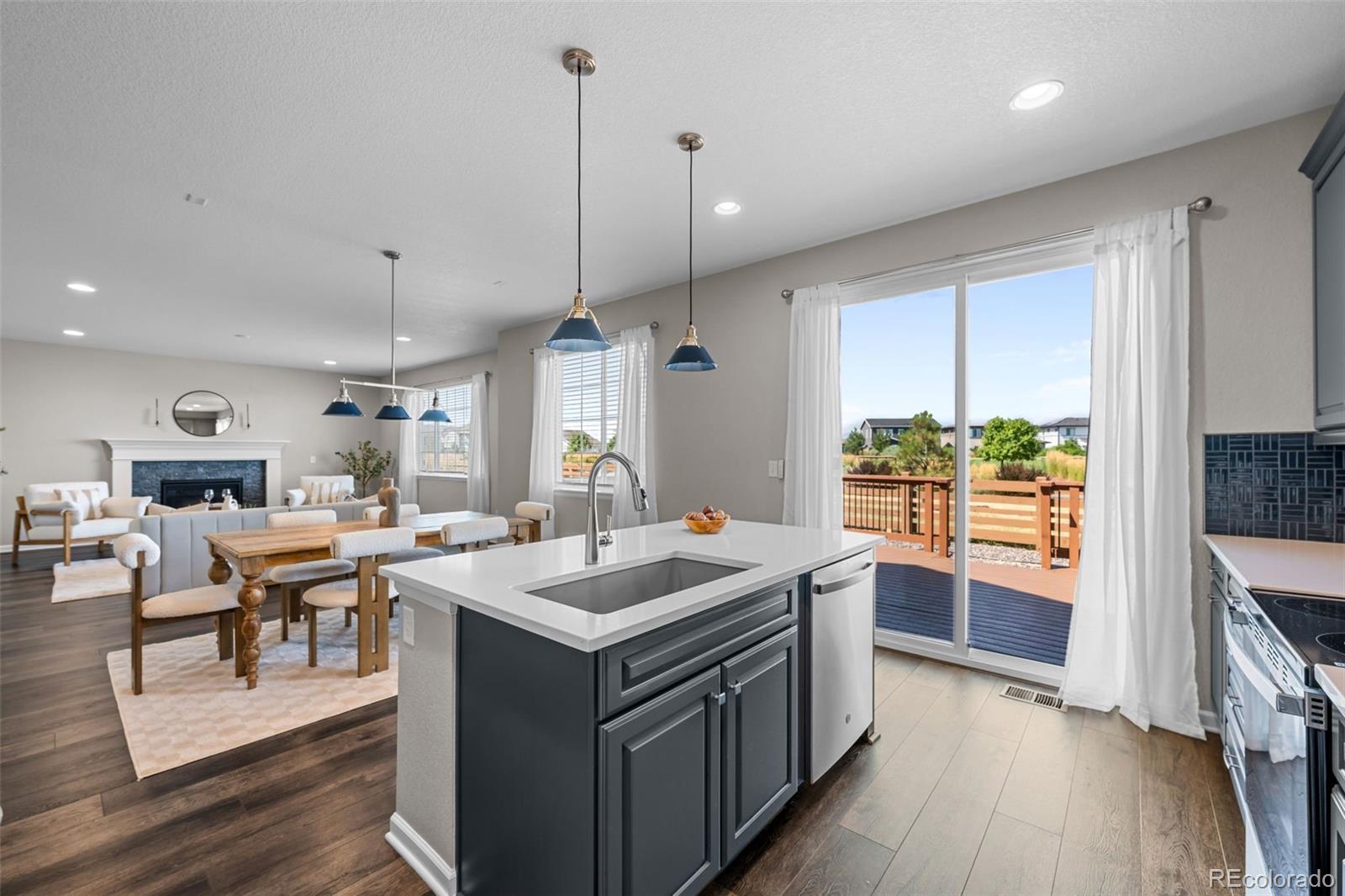 450 Pikes View Drive Erie, CO 80516 - Photo 16 of 45 a open kitchen with stainless steel appliances granite countertop a stove and a refrigerator
