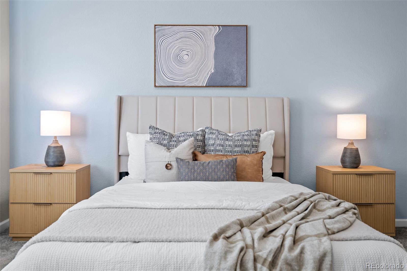 450 Pikes View Drive Erie, CO 80516 - Photo 25 of 45 a bedroom with a bed and a lamp with the bathroom