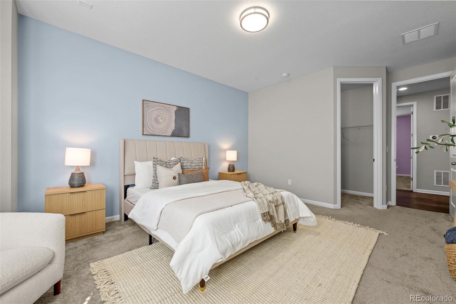 450 Pikes View Drive Erie, CO 80516 - Photo 26 of 45 a bedroom with a bed and a couch