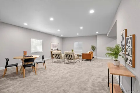 a room with furniture and a potted plant