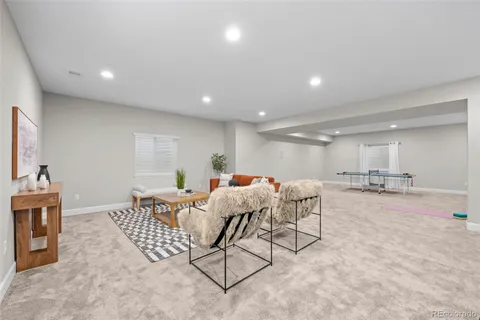 a living room with furniture and a table