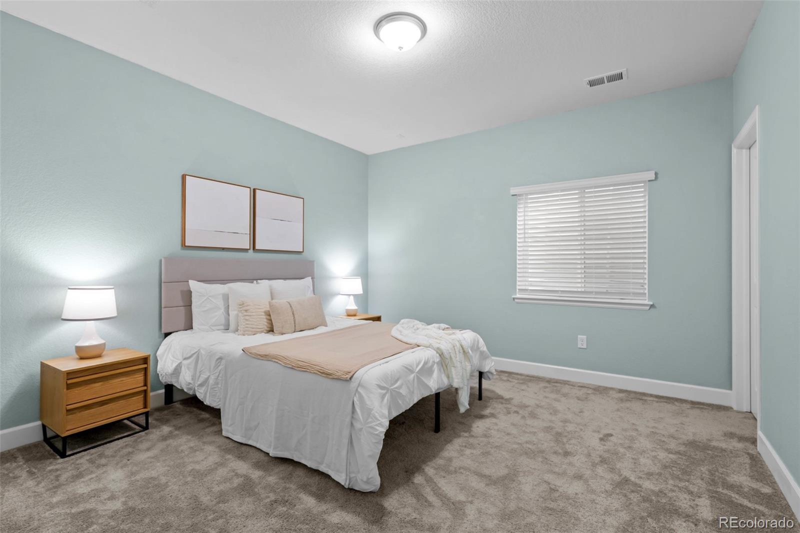 450 Pikes View Drive Erie, CO 80516 - Photo 39 of 45 a bedroom with a bed and a window