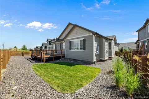 a view of a house with a yard porch and sitting area
