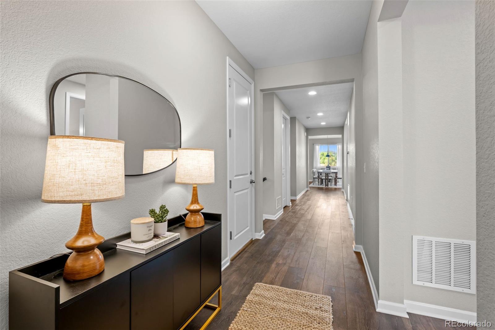450 Pikes View Drive Erie, CO 80516 - Photo 5 of 45 a view of a hallway to a livingroom and a couch