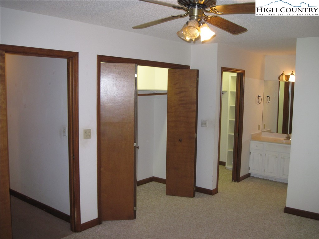 281 Old Turnpike Road Banner Elk, NC 28604 - Photo 15 of 22 a view of empty room with window and chandelier fan