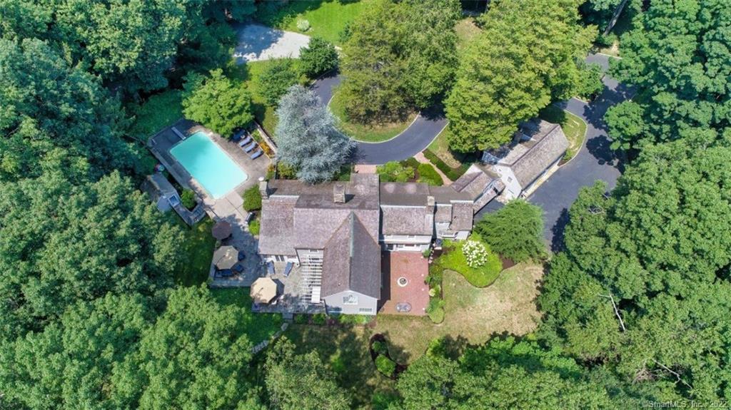 Exciting country estate in South Wilton! Beautiful property on over 4 acres, professionally-landscaped with horse barn and paddock, and inground heated pool with poolhouse.