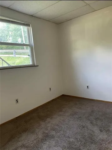 a bathroom with a sink a mirror and a toilet