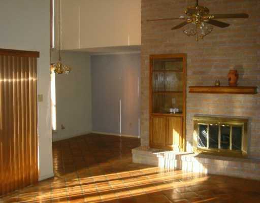 0 Middlecoff Corpus Christi, TX 78413 - Photo 2 of 3 an empty room with wooden floor a fireplace and entryway