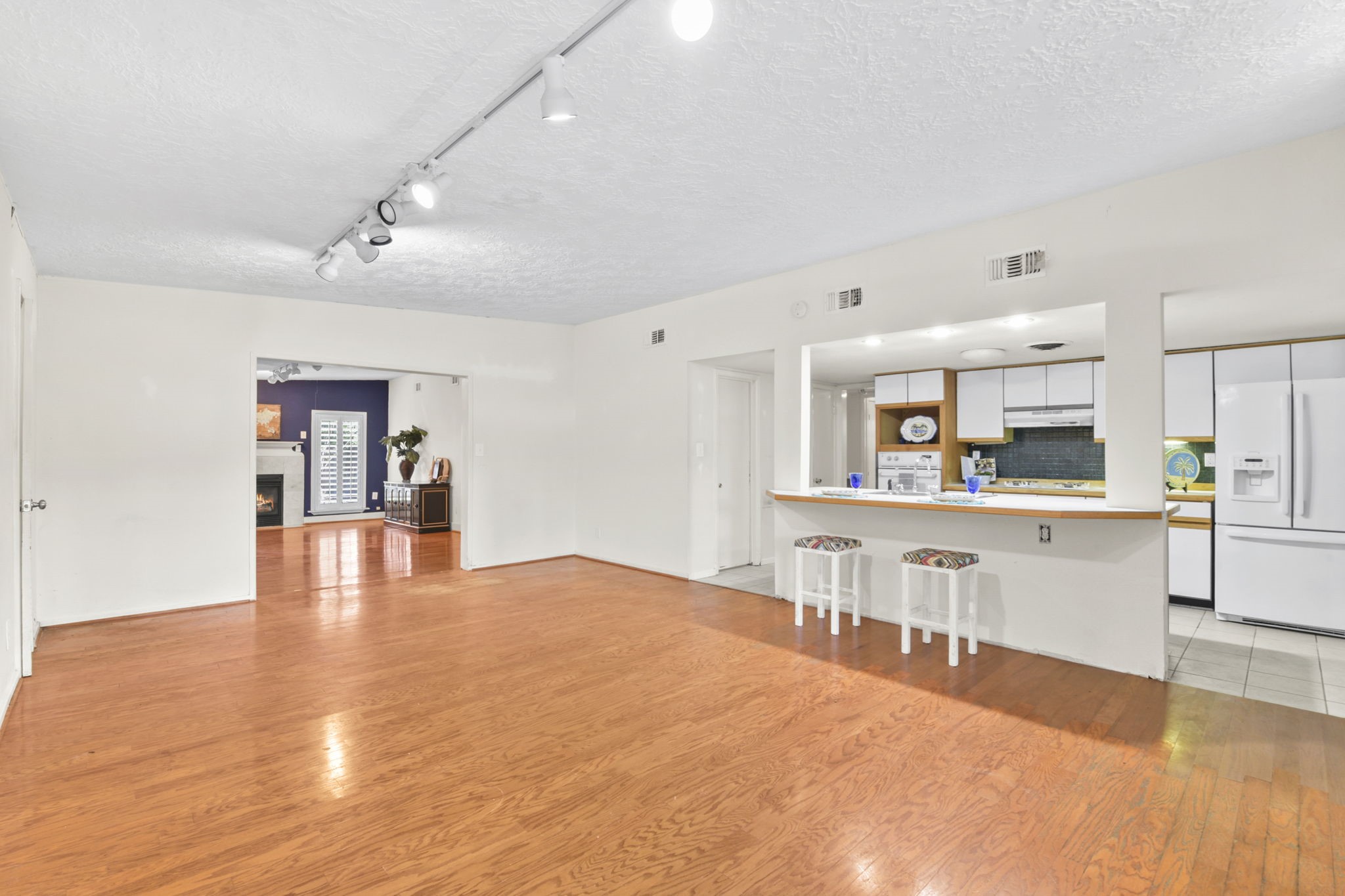 1202 Fay Road Kemah, TX 77565 - Photo 3 of 32 a view of kitchen with cabinets and wooden floor