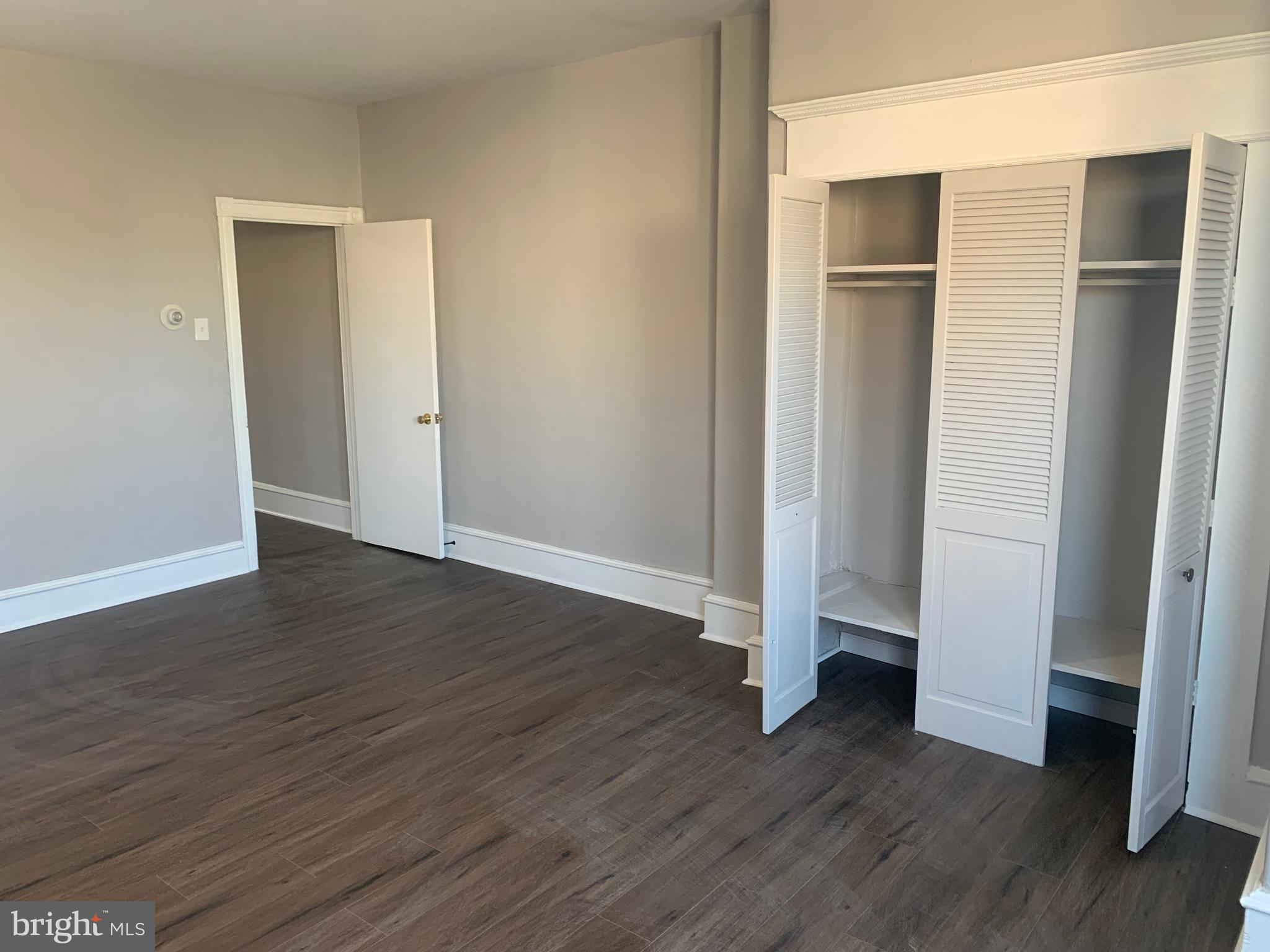 2387 Orthodox Street Philadelphia, PA 19137 - Photo 5 of 12 a view of empty room with wooden floor