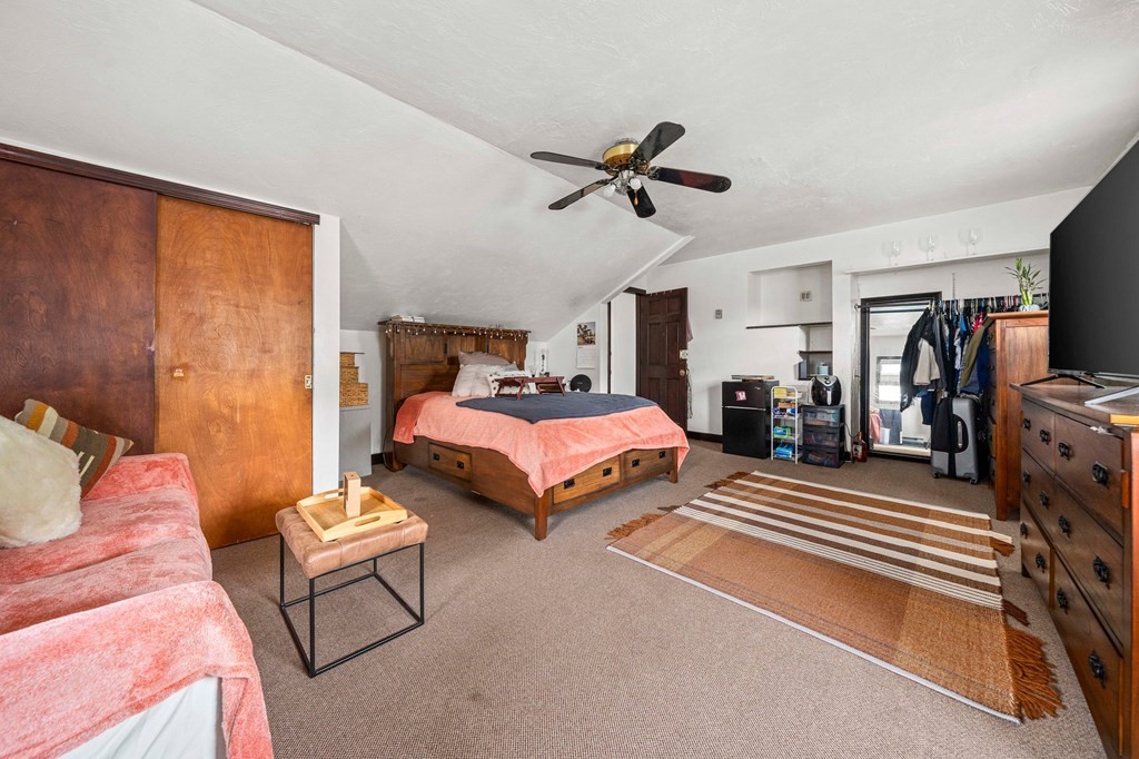 65 Wyvern Street Boston, MA 02131 - Photo 16 of 26 a bedroom with two beds and a window