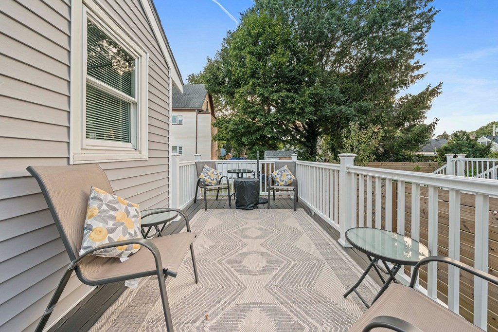 65 Wyvern Street Boston, MA 02131 - Photo 20 of 26 a view of a chairs and table on the balcony